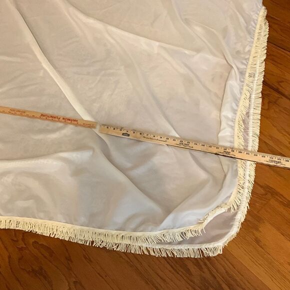 Tablecloth 136” X 112”. Cream nearly sheer